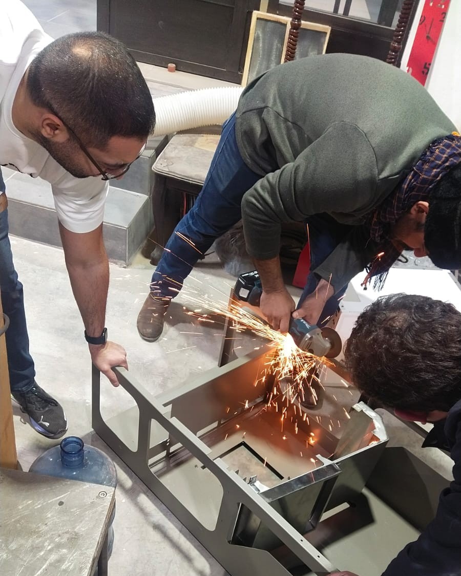 Fabricating the rebuilt hardware on the bench.