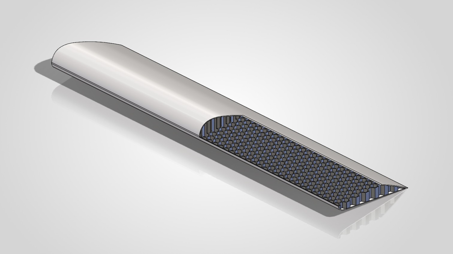 Wing cross-section showing the aluminium-honeycomb-and-carbon-fibre sandwich under the skin.